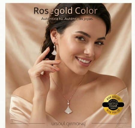 Modelo usando set completo de collar y aretes rosegold con dijes tipo abanico de cristales austriacos.